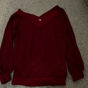 A used maroon sweater very cute warm comfortable